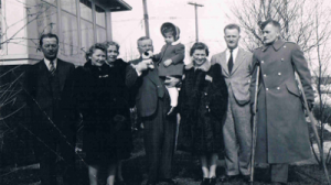 Family photo; Eddie right with crutches