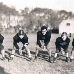 American football, 2nd from left