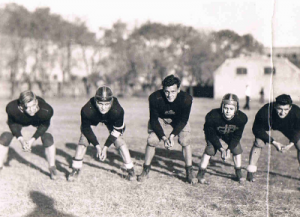 American football, 2nd from left